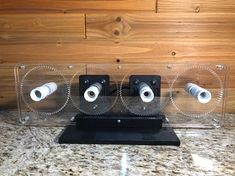 two speakers sitting on top of a counter