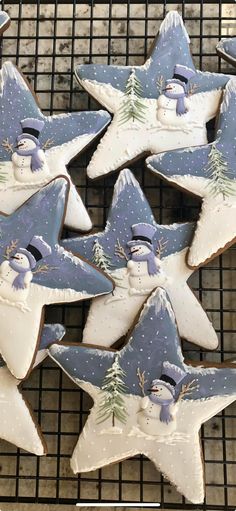 some decorated cookies are on a cooling rack