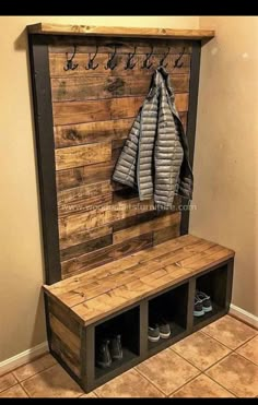 a coat rack and bench made out of pallet wood with shoes on the bottom shelf