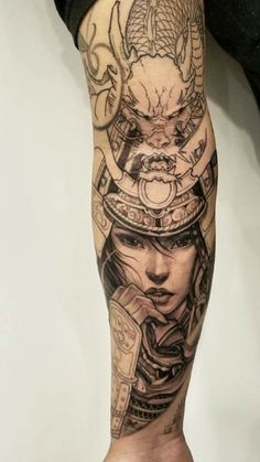 a person with a tattoo on their leg that has a woman's head in the middle