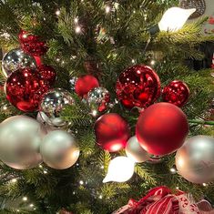 a christmas tree with red and silver ornaments