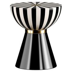 a black and white vase with gold trimmings on the top, sitting in front of a white background