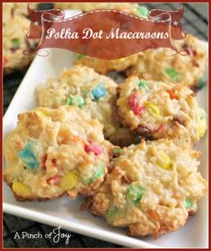 a white plate topped with cookies covered in candy