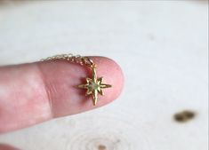 "Tiny Star Necklace, Tiny North Star Necklace, 14k Gold Filled Star Necklace, Polestar Necklace, Tiny Gold Star Necklace, Gift for her Tiny North Star Necklace in Gold. Our 1/2\" Tiny North Star is Vermeil Gold (18k gold, plated over solid sterling silver). Beautifully detailed, this piece is the perfect addition for any collection. 16\" or 18\" 14k Gold Filled chain. Perfect for gift giving. :)" Handmade Gold Star Charm Necklaces, Gold Star Charm Necklace Handmade, Handmade Gold Charm Necklaces With Star Shape, Handmade Gold Star Charm Necklace, Star-shaped Charm Necklace For Gift, Gold Jewelry With Star Print For Gift, Tiny Star Necklace, Gold Star Necklace, North Star Necklace