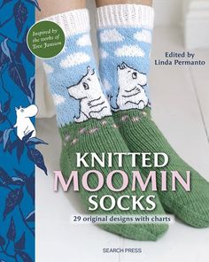 the cover of knitted moomin socks is shown in blue and green colors