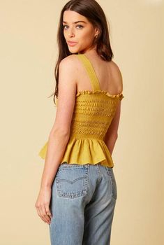 Final Sale - Get it before it's gone! Make moves in the Elsa Mustard Peplum Tank Top! We are loving this top for summer daze! Light-weight dijon mustard smocked fabric with white stitching forms a tank top bodice. Ruffled hem and attached wide straps. Pullover style. DETAILS & CARE Rayon. Machine Wash Cold. Imported. ORDERS, SHIPPING & RETURNS Orders, Shipping, & Returns Affordable Mustard Summer Top, Cheap Mustard Crop Top For Spring, Affordable Fun Yellow Tops, Cheap Mustard Tops For Fall, Affordable Yellow Fun Top, Mustard Summer Blouse Affordable, Yellow Spliced Top For Summer, Peplum Tank Top, Boho Pink