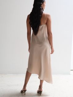 This Vintage Pianoforte di Max Mara Silk Slip Dress is a classic, elegant piece perfect for any special occasion. Made with silk, it is both comfortable and chic. The aysmmetrical design adds a touch of sophistication, making you stand out in any setting. PRODUCT DETAILS + FIT: Made in Italy Bust: 36" Waist: 34" Hips: 40" Elegant Asymmetrical Hem Party Slip Dress, Silk Slip Dress With Asymmetrical Hem For Party, Fitted Evening Slip Dress With Asymmetrical Hem, Fitted Slip Dress With Asymmetrical Hem For Evening, Elegant Asymmetrical A-line Evening Dress, Chic Fitted Slip Dress With Asymmetrical Hem, Summer Gala Midi Asymmetrical Dress, Spring Gala Slip Dress In Midi Length, Elegant Evening Slip Dress With Asymmetrical Hem