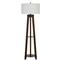 a wooden floor lamp with a white shade on the top and bottom shelf below it