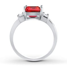 An emerald-cut lab-created ruby twinkles at the center of this sterling silver ring. Shiny round lab-created white sapphires add sparkle. Fine Jewelry Rings With Lab-created Ruby And Accent Stones, Red Baguette Cut Diamond Accent Rings, Princess Cut Lab-created Sapphire Jewelry With Center Stone, Dazzling Jewelry With Brilliant Cut Lab-created Ruby, Gift Rings With Diamond Accents And Lab-created Ruby, Lab-created Ruby Rings With Diamond Accents For Gift, Gift Ring With Diamond Accents And Lab-created Ruby, Lab-created Ruby Ring With Diamond Accents As Gift, Baguette Cut Ruby Jewelry With Diamond Accents