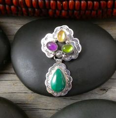 Navajo handmade sterling silver pin pendant with amethyst, citrine, and malachite gemstones, featuring intricate floral and scalloped silver designs. Citrine Cluster, Vintage Jewellery Rings, Navajo Jewelry, Green Malachite, Pendant Watches, Jewelry Showcases, Peridot Stone, Pin Pendant, Men's Jewelry Rings