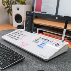 a computer keyboard sitting on top of a desk next to a mouse and monitor screen