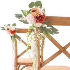 two vases filled with flowers sitting on top of a wooden chair next to each other