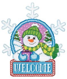 a snowman with a green hat and scarf on top of a sign that says welcome