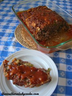 a piece of meatloaf on a plate next to a casserole dish