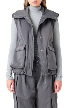 Everyone's favorite for the 'between' season, this roomy vest boasts plenty of pocket space for your out-and-about essentials. Front snap closure Stand collar Front flap-patch bellows pockets Lined 50% polyester, 50% Tencel® lyocell Tencel lyocell is a sustainably produced fiber made with closed-loop processing Hand wash, dry flat Imported Sleeveless Outerwear With Patch Pockets For Fall, Sleeveless Fall Outerwear With Patch Pockets, Fall Sleeveless Vest With Patch Pockets, Sleeveless Vest With Multiple Pockets For Spring, Spring Sleeveless Vest With Multiple Pockets, Utility Vest With Patch Pockets For Fall, Winter Utility Sleeveless Vest, Utility Sleeveless Vest For Winter, Functional Spring Vest With Pockets