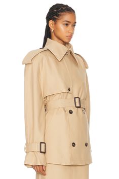 Find WARDROBE.NYC Cropped Trench In Beige on Editorialist. WARDROBE.NYC Cropped Trench in Beige Self: 100% cotton Lining: 100% viscose. Made in Slovakia. Hand wash. Front button closure. Slant pockets. Includes shoulder pads. Includes waistbelt. Belt buckle accented cuffs. WNYF-WO57. W4073R16. About the designer: WARDROBE.NYC is a conceptual composite of luxury essentials, distilled into their purest and most versatile form. Designed for a modern urban life, the line consists of timeless wardrobe staples in a practical minimalist style. The label was founded in 2017 by Josh Goot and Christine Centenera, who wanted to create a better alternative to the current fashion system. Instead of the relentless production-consumption cycle, WARDROBE.NYC dreamed up an improved business model that is m Designer Wardrobe, Christine Centenera, Cropped Trench Coat, Luxury Essentials, Wardrobe Nyc, Khaki Jacket, Womens Khakis, Timeless Wardrobe Staples, Trench Jacket