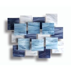 blue and white abstract painting with squares in the center on a white background, created using acrylic paint