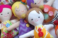 a group of dolls sitting next to each other