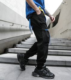 Men Multi-pocket Elastic Waist Harem Pant Men Streetwear Punk Hip Hop Casual Trousers Joggers Male Pants 2021 New Dropshipping Black Jeans With Elastic Waistband For Streetwear, Hip Hop Tapered Leg Pants With Pockets, Black Joggers With Pockets For Spring, Casual Ankle-length Cargo Pocket Jeans, Casual Ankle-length Jeans With Cargo Pockets, Urban Blue Tapered Leg Pants, Urban Fitted Pants With Elastic Waistband, Fitted Urban Pants With Elastic Waistband, Black Ankle-length Jeans With Pockets