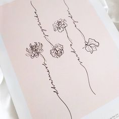 three flowers are drawn in black ink on a light pink background with white paper underneath