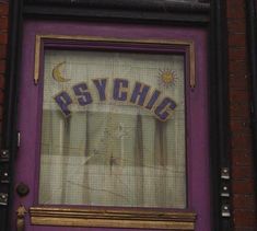 a purple door with the word psychic painted on it