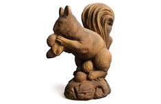 a statue of a squirrel holding a squirrel on its back