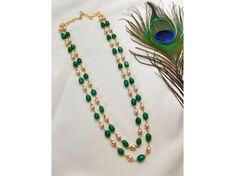 Elevate your style with our exquisite Gold Tone Green Pearl Double Layer Mala Necklace, inspired by South Indian jewelry. Embrace the traditional touch of Gutta Pusalu design, perfect for parties and sari wear. This intricately crafted piece combines elegance and heritage, making it a must-have accessory for any occasion. Necklace Only Necklace Has Been Adjustable Cord Gold Tone , Pearl , Beads *PERFECT GIFT FOR YOUR LOVED ONES* *FOR ANY QUERIES AND INFORMATION PLEASE MESSAGE US*  *SHOP LINK - h Luxury Temple Necklace With Polished Beads For Wedding, Elegant Polished Beads Necklace For Marriage, Elegant Handmade Necklaces For Marriage, Traditional Green Necklaces For Marriage, Green Necklace For Marriage And Festive Occasions, Jade Beads Necklace Indian, Traditional Beaded Necklaces For Marriage, Luxury Traditional Beaded Temple Necklace, Traditional Gold Long Beaded Necklace