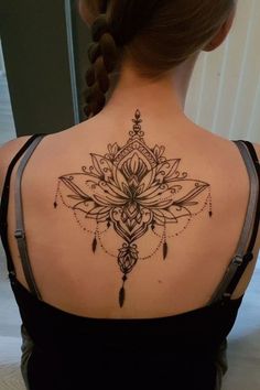 a woman with a tattoo on her back