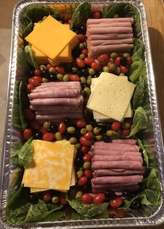 a metal tray filled with different types of food