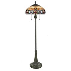 a floor lamp with a stained glass shade on it's top and bottom part