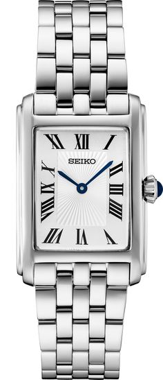 Ladies silver tone, rectangle face, Seiko watch, with Roman numerals, and a blue jewel on crown stem. Water restistant, 5BAR, with a Hardlex Crystal. #SWR083 Rectangle Watch Women, Classic Silver Rectangular Jewelry And Watches, Seiko Tank, Luxury Silver Rectangular Dial Watch, Antique Silver Watch With Rectangular Dial, Seiko Ladies Watch, Seiko Rectangular Watch, Rectangle Face, Seiko Watch