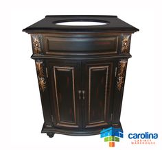 an ornate wooden cabinet with black top and gold trimmings on the front door