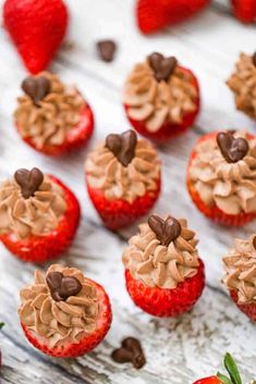 chocolate covered strawberries are arranged on a table