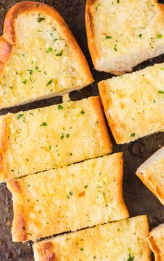 slices of garlic bread sitting on top of a pan