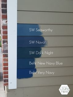 some blue paint on the side of a house that is being painted in different colors