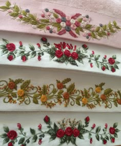 three different types of embroidered flowers on towels