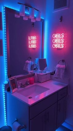 a bathroom with neon lights on the walls