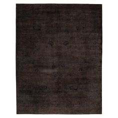 an antique rug with dark brown and black colors