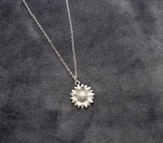 "Sunflower necklace. DETAILS: Gold Charm - Gold Filled, 18 mm Silver Charm - Rhodium Plated, 18mm Chain - 14k Gold Filled, 925 Sterling Silver Upgrade to a lobster clasp:  https://www.etsy.com/listing/1048434541/lobster-clasp-upgrade?ref=shop_home_active_21&frs=1 Can't decide on a length? Add an EXTENDER to make your necklace adjustable in length: https://www.etsy.com/listing/796970603/necklace-extender-removable-extender?ref=listings_manager_grid MEASURE - For the perfect fit. 1- Use a string to mark where you'd like your necklace to hang 2- Lay the string on a ruler to measure the length PACKAGING: All jewelry is packaged in a jewelry box ready for gifting.  Comes with a polishing cloth to clean the sterling silver.  ABOUT 925 STERLING SILVER: Use a polishing cloth to clean your silver i Silver Jewelry With Sunflower Design Flower Pendant, Silver Sunflower Pendant Jewelry, White Gold Flower Charm Necklace, Silver Sunflower Necklace For Mother's Day, Silver Hypoallergenic Flower Necklace, Silver Necklace With Sunflower Pendant, Silver Sunflower Pendant Necklace, Silver Sunflower Design Necklace, Silver Sunflower Design Flower Necklace