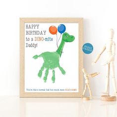 a green dinosaur with balloons is shown next to a wooden toy and a framed photograph