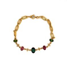 This dazzling Art Nouveau Tourmaline & Diamond Bracelet features multi-colored gemstones in 18k yellow gold. A vintage bracelet with a timeless look. Four (4) tourmalines decorate the ornate chain bracelet, reflecting hues of rosy reds and greens. A collection of earthy gemstones with cosmic charm. Four (4) accent diamonds add a pop of sparkle, mounted in-between each tourmaline. Finished on a decorative yellow gold chain link bracelet measuring 7 inches long. A chic gift for you or your loved o Gold Vintage Bracelet, Vintage Yellow Gold Bracelet With Jewels, Elegant Gold Tourmaline Bracelets, Victorian Yellow Gold Bracelet, Art Nouveau 14k Gold Jewelry With Gemstones, Art Nouveau Gemstone Jewelry, Luxury Vintage Gold-tone Bracelets, Vintage Gold Bracelet, Chic Gifts