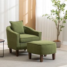 a green chair and ottoman in a living room