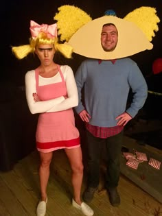 two people dressed in costumes standing next to each other