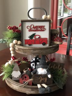 a wooden tray with christmas decorations on it