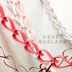 red and white paper hearts hanging from a string