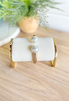 When In Doubt Pearl Bracelet, gold half cuff bracelet with big white pearls on the ends Pearl Bracelets Tiffany & Co., Hinge Bracelet, Pearl Details, Hinged Bracelet, The Pearl, Easy Wear, Accessories Bracelets, Pearl Bracelet, Classic Looks