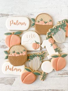 decorated cookies with peaches and leaves are arranged in the shape of pumpkins on top of each other