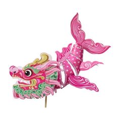 a pink and green dragon head on top of a wooden stick in front of a white background