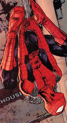 a drawing of a spider - man hanging upside down on the ground in front of a building