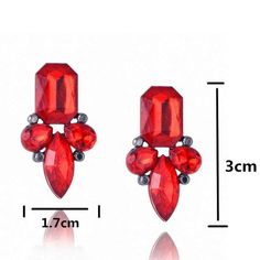 A large emerald-cut red gemstone gives way to several more red rhinestones. These dainty beauties are perfect for day or night. 1.18" x .67". Affordable Necklaces, Vintage Wedding Jewelry, Blue Stud Earrings, Engagement Earrings, Ear Earrings, Wholesale Gifts, Alloy Earrings, Red Gemstones, Matching Jewelry